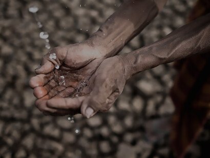 Amidst the challenges of water scarcity and drought, an elderly gentleman sits, his plea for rain echoing through the barren landscape