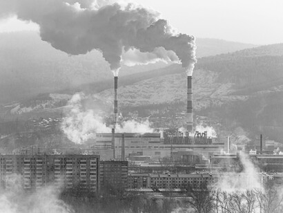 A tranquil winter scene interrupted by a distant industrial skyline, blending stillness with underlying tension