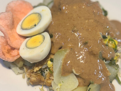 Rich and creamy peanut dressing envelops every ingredient in this plate of gado-gado, creating a beautiful blend of textures and tastes that represent Jakarta's diverse culinary influences