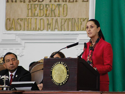 Current President Claudia Sheinbaum speaking at a conference