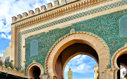 The vibrant blue entrance of Bab Bou Jeloud, symbolising Fez’s enduring artistic and architectural legacy