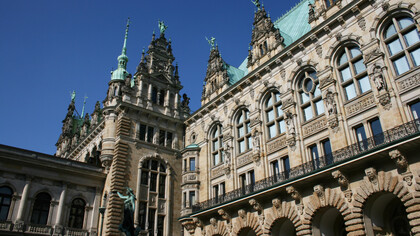 The iconic city hall in Hamburg, Germany, a vast Neo-Renaissance building built in 1897, a testament to cultural integration and the power of diverse perspectives