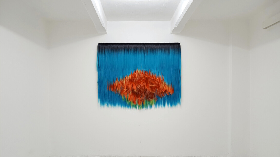Untitled (Fire & Water), 2023, synthetic hair on canvas and wooden bar, 125x152x8 cm, 49¼x59¾x3¼ inches, unique. Courtesy the artist and The Flat