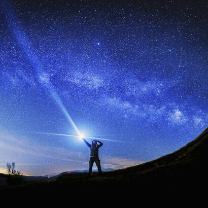 A person viewing the skies at night