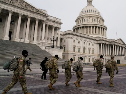 Members of the National Guard arrive to the US Capitol days after supporters of US President Donald Trump stormed the Capitol in Washington, D.C.