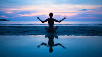 Meditating at sunset