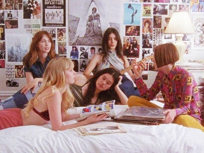 A 90s teenage room filled with posters, where friends gather and spend time together