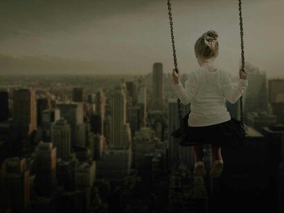 A dream of a girl swinging dangerously in the open air looking over a familiar metropolitan city