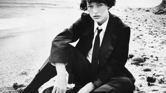 The famous actress and model Milla Jovovich, dressed like a man