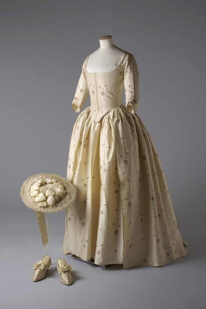 Silk brocade gown, hat and shoes, 1780. Image reproduced by kind permission of the Olive Matthews Collection, Chertsey Museum. Photograph by John Chase