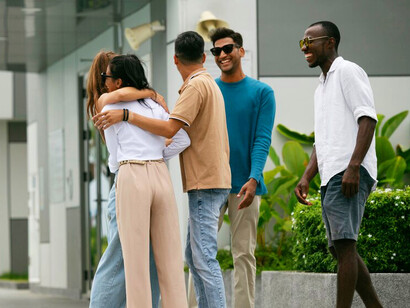 In a moment of shared joy and support, the group reflects the value of collectivism, reminding us that the common good thrives when individuals come together for a common purpose