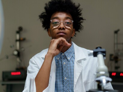 A Black scientist advancing research , reflecting the courage to challenge boundaries and create lasting change