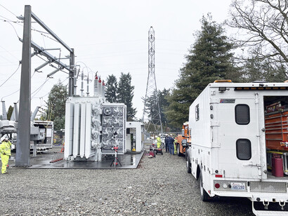 A Tacoma Power crew works at an electrical substation damaged by vandals in Graham, Washington, USA