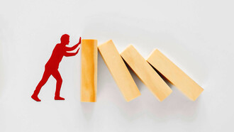 Financial problems, with a downward trending red graph and stack of coins, symbolizing economic challenges and instability