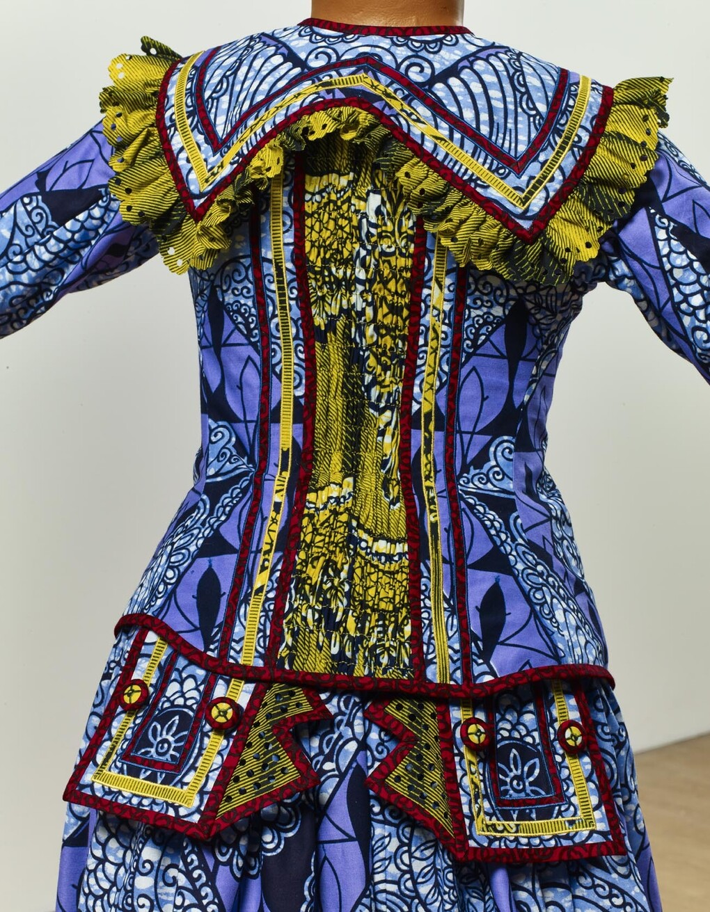 Yinka Shonibare MBE b. 1962, Girl Balancing Knowledge (2015)
Fibreglass mannequin, Dutch wax printed cotton textile, books, globe and steel baseplate
179 x 139 x 89 cm (70 1/2 x 54 3/4 x 35 in.)
Photographer: Stephen White
Image courtesy the artist, Stephen Friedman Gallery,
London and Pearl Lam Galleries, Hong Kong, Shanghai
and Singapore. Detail