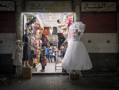 Giorgio Bianchi, Donbass stories - Spartaco and Liza: Liza as she tries on a wedding dress in a department centre in Donetsk.
Spartaco and Liza hope to marry by next Spring and they are looking forward to having Elena, Spartaco’s mother, come for the first time in Donbass