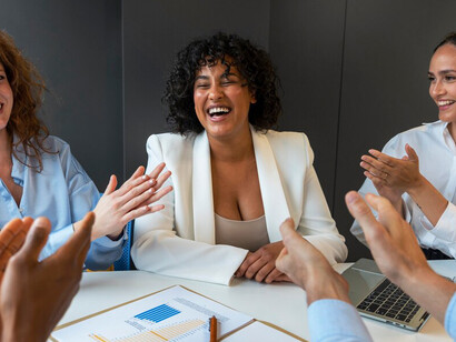 Business leaders applauding at a public appreciation event, highlighting community recognition, awards ceremonies, and diverse recognition programs