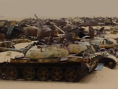 Abandoned Iraqi tanks in the Kuwaiti desert, likely along the so-called “Highway of Death,” during the Gulf War.