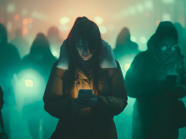 A view of individuals immersed in their phones, scrolling through screens without pause