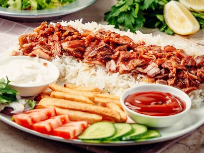 Iskender kebab with rice and vegetables