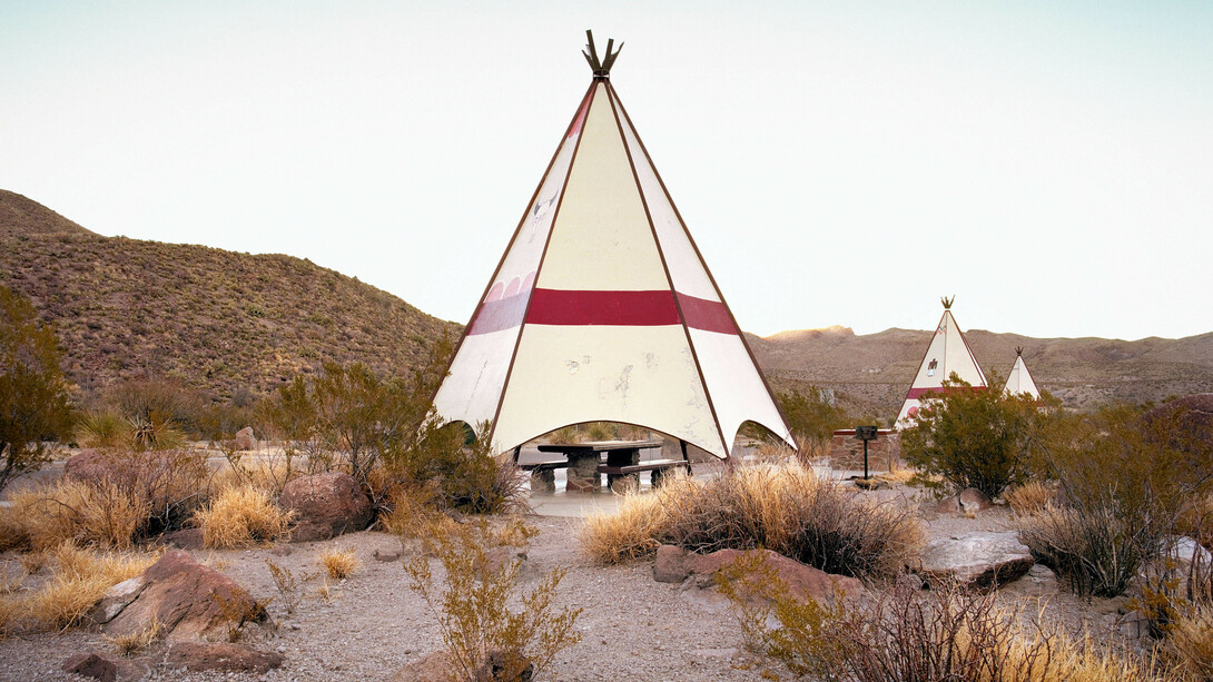 Ryann Ford. Near Lajitas, Texas – FM 170 – This is one of the most remote rest areas in the country. These teepees are hidden just outside Big Bend National Park, right on the Rio Grande, which divides the United States and Mexico. As we were shooting, a pack of Javelinas ran by.
