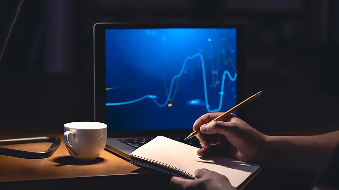 A man browses online stock investments at night, actively engaging in trading strategies for potential gains