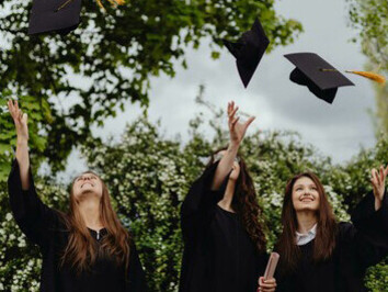 Young women celebrating their university graduation