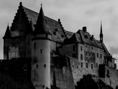 A Gothic-style castle overlooking the town of Vianden, Luxembourg
