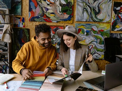 Two creators exploring their craft together, symbolising the fusion of imagination and connection