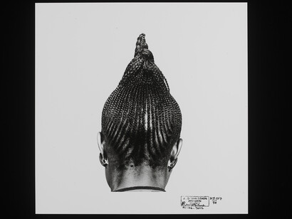 J. D. 'Okhai Ojeikere, 'HD-55774 (Beri Beri)', from the series Hairstyles, gelatin silver print, Nigeria, 1974 © The Estate of J.D. 'Okhai Ojeikere / Victoria and Albert, London
