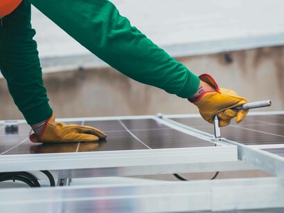 Man installing solar panel