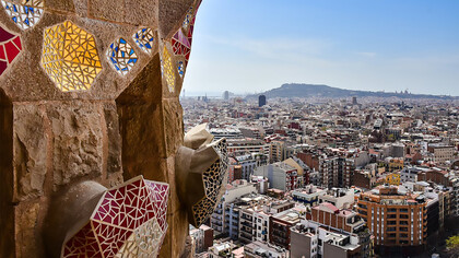 A breathtaking view from the top of the Basílica i Temple Expiatori de la Sagrada Família, overlooking the vibrant cityscape of Barcelona, Spain