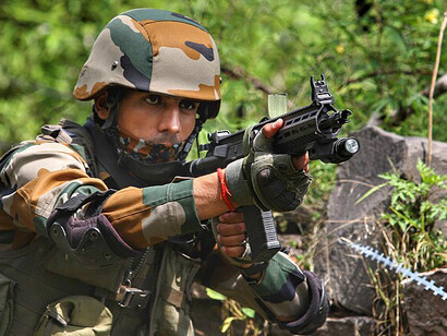 A soldier from the Indian Army’s White Knight Corps carries a modified AK-type rifle