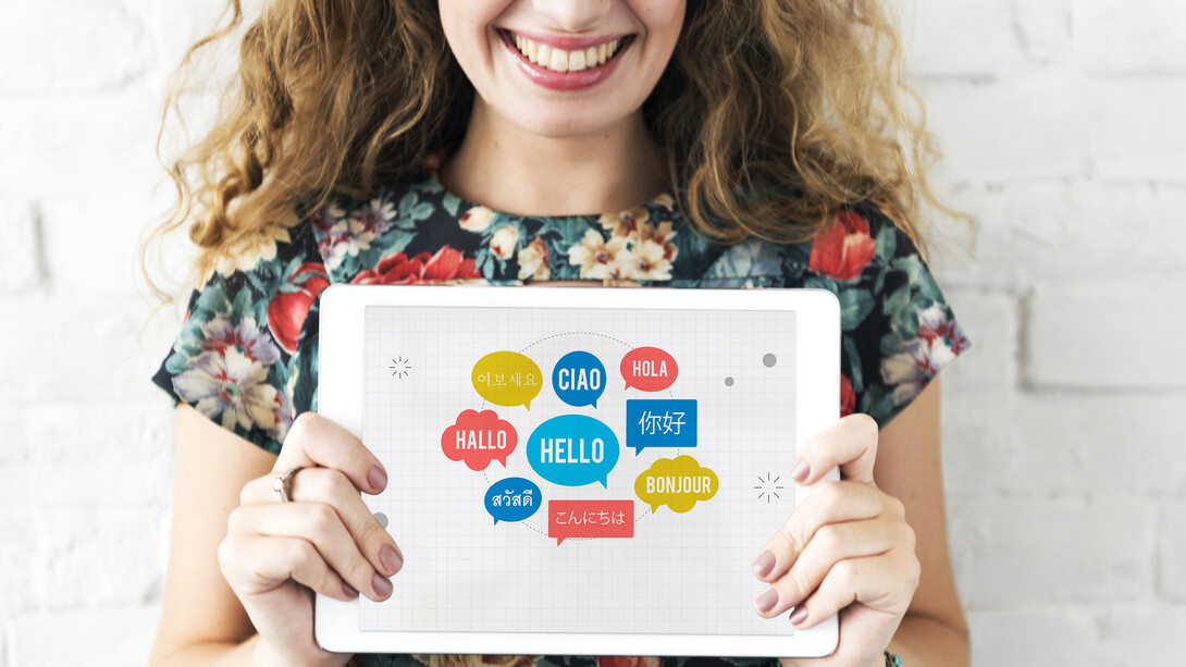 "Hello" in different languages in bubbles on an ipad