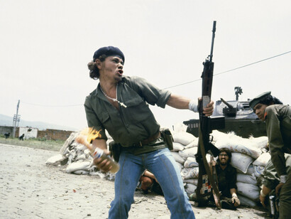 Susan Meiselas, Sandinistas at the walls of the Estelí National Guard headquarters, “Molotov Man,” Estelí, Nicaragua, July 16, 1979, 1979; © Susan Meiselas/Magnum Photos