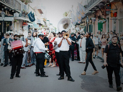 People enjoying live music at a street festival in New Orleans, USA