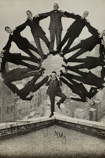 Unidentified maker, Man posed on the corner of a rooftop with an arc of eleven
suited men balanced on his shoulders (detail), ca. 1930. Courtesy of George Eastman Museum