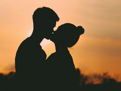 A couple kissing silhouette on the beach