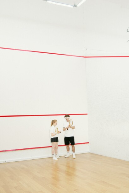 Coach and trainee, squash game