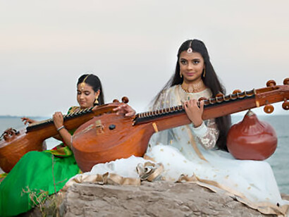 Two girls perform a veena recital by the shores of Lake Ontario in Toronto, Canada