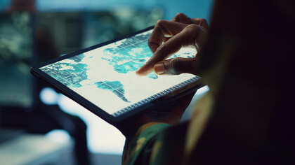 An IT professional leverages artificial intelligence and geospatial technology to gather insights from world map projections, utilizing the power of generative AI for enhanced data analysis