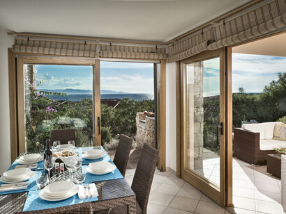 The enchanting Hotel Torreruja in Isola Rossa, Sardinia, Italy, combines luxury and nature with panoramic views of the Costa Rossa coastline