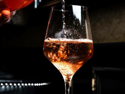 One of Great Britain's finest wines is being poured gently into a glass as the bubbles begin to surface to the top