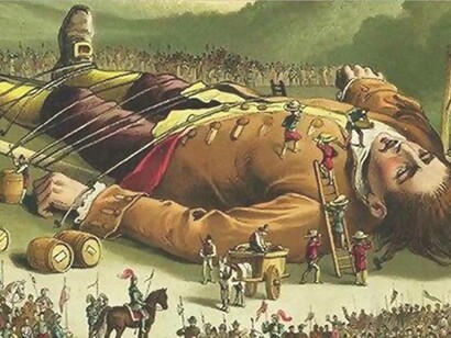 An unconscious Gulliver is tied up by the inhabitants of Lilliput and being examined
