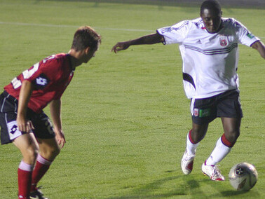 Troy Lessane of the Charleston Battery challenges Freddy Adu of D.C. United