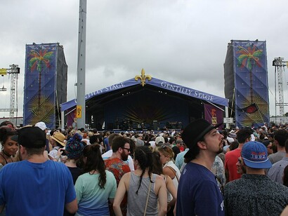 Festivalgoers enjoying the lively performances and festive spirit at the New Orleans Jazz Fest 2017, USA