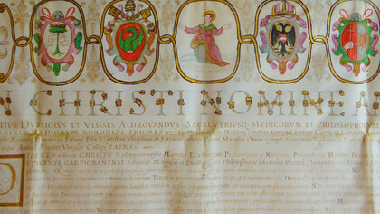 Incipit del diploma di laurea in medicina e filosofia, con il nome d'Ulisse Aldrovandi, pergamena, sigillo di ceralacca con Santa Caterina d'Alessandria, rilasciato dall'Università di Bologna a Lelio Vincenti nel 1587