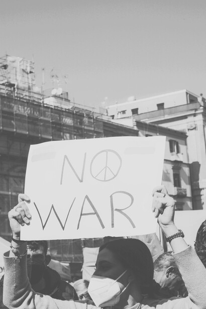 Protestors calling for an end to war in a Stop War sign