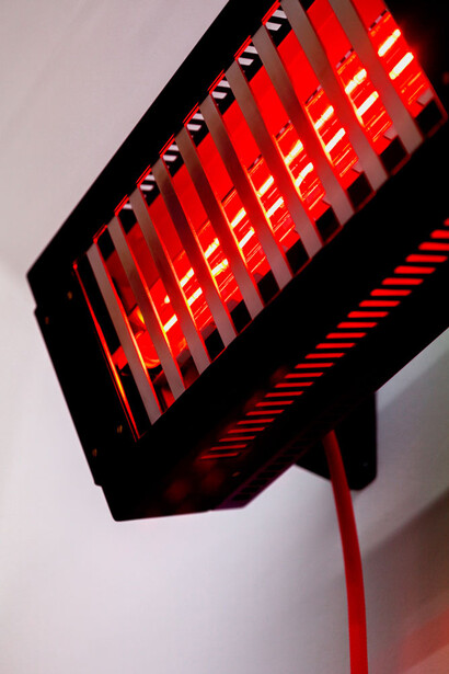 Natalie Dray, Infrared Fuchsia, 2015, Lamp holder, Ruby Jacketed Lamp,Ceramic Connector,1.5mm 3 core butyl flex, M20 Cable Gland, Rugged Plug Top, Powder coated Steel, Stainless steel + universal burning position, 1500W. Image courtesy the artist and Cell Project Space, London. Photo: Mariell Amélie