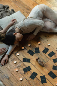 In a sacred space of candles and connection, women gather to visualise their dreams, aligning heart and mind with intention